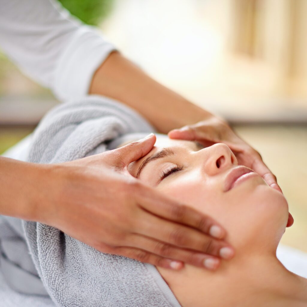 Cropped shot of a young woman enjyoing a massage at the day spa